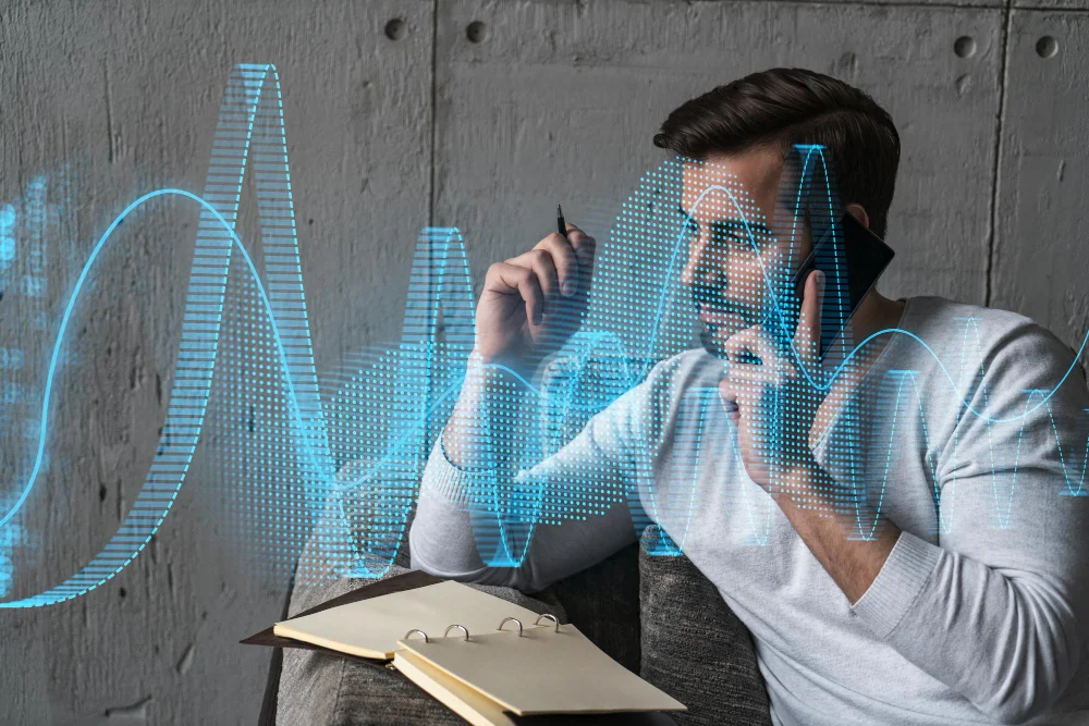 A man analyzing data with a digital holographic graph overlay while talking on the phone, exploring the question, "which statement is true regarding artificial intelligence."