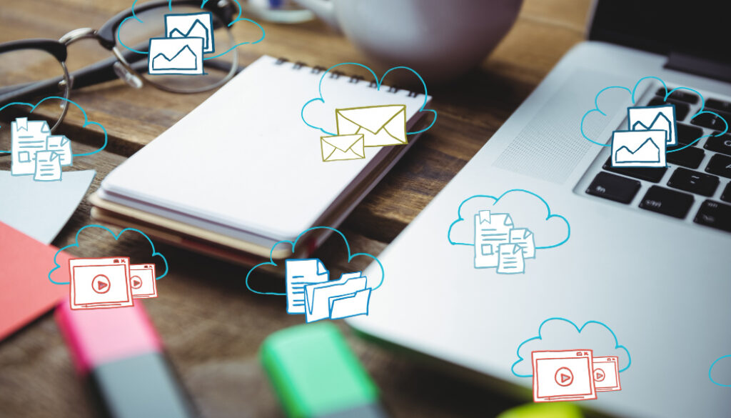 Workspace with a laptop, notebook, glasses, and highlighters surrounded by cloud icons representing digital content.