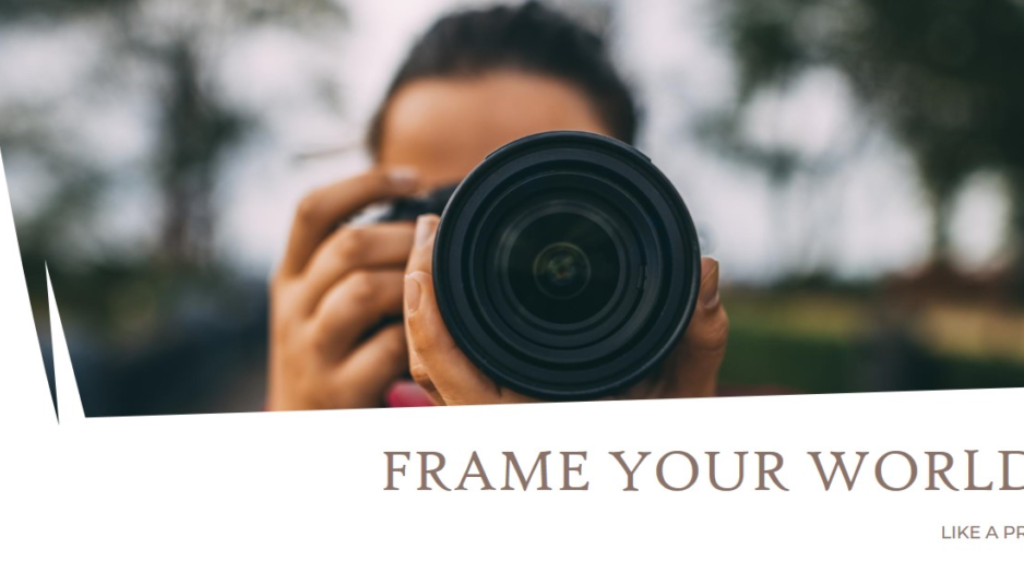 Close-up of a camera held by a photographer, emphasizing the phrase "Frame Your World" and inviting a fresh perspective. photo