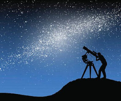 Person stargazing through a telescope under a starry night sky.